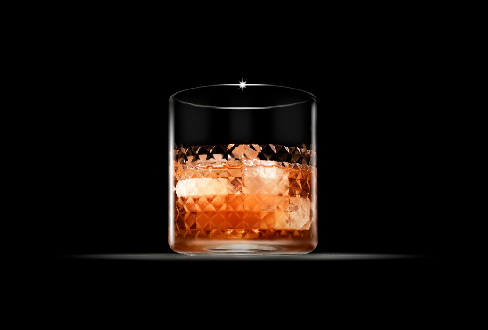 clear drinking glass with brown liquid