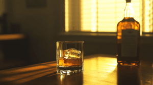 whiskey glass and. bottle